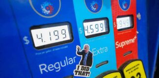 Gas pump with prices and sticker on the Extra button
