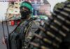 Top Hamas Boss GRABBED Alive armed person in camouflage and face covering on a city street