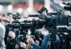 Court Cage Match Freezes Missouri Maps Broadcast cameras on tripods at a press event