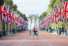 Budget Crunch Looms—War Shock Triggers UK Panic mounted guard on white horse along flag-lined boulevard