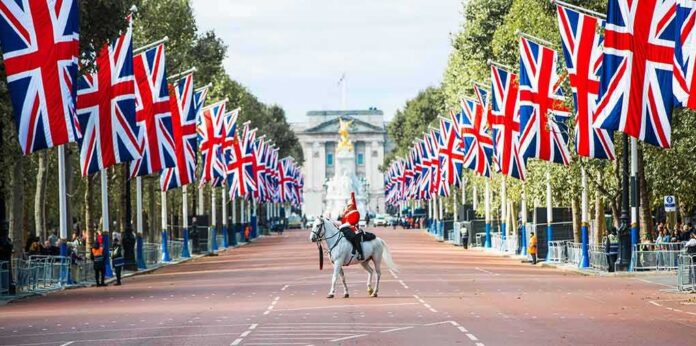 shutterstock_2202756495 mounted guard on white horse along flag-lined boulevard