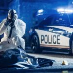 Caught On Camera: Brutal Wheelchair Attack forensic investigator photographing crime scene near police car