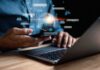Courts Crack Open Chatbot Death Cases Person using smartphone and laptop with AI hologram