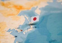 Quake Chaos: Panic Outruns The Facts Japanese flag pin marking Japan on a world map