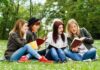 DA’s Picnic Meets Fentanyl Reality Group of young women reading books on grass in a park