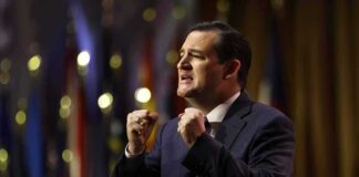 Ted Cruz speaking on stage with raised fists