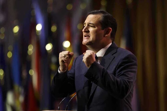 shutterstock_388723816 Ted Cruz speaking on stage with raised fists
