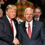 Donald Trump and Mike Pence shake hands on stage; Jeff Lord is in the background