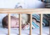 Baby sleeping in a crib
