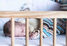 Baby sleeping in a crib