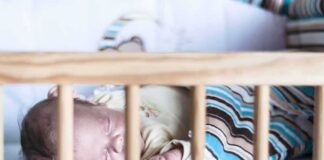 Baby sleeping in a crib