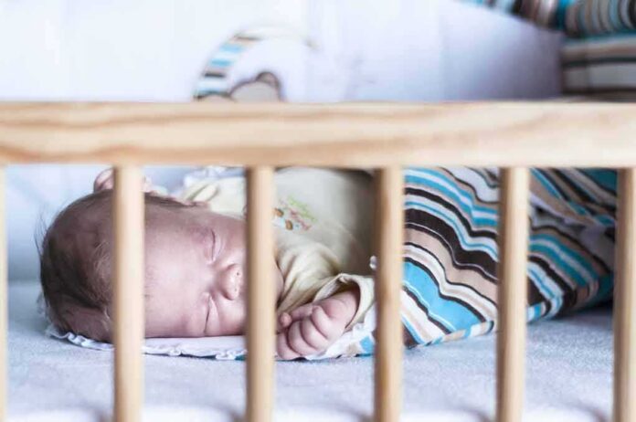 Baby sleeping in a crib