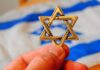 Star of David pendant held by hand
