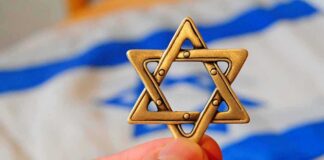 Star of David pendant held by hand