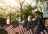 Backlash Erupts: Keep Mamdani Off Stage American flags displayed outdoors at a memorial