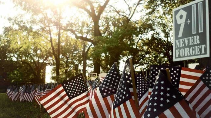 shutterstock_650176444 American flags displayed outdoors at a memorial
