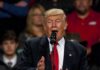 Fans Revolt After Trump Fat-Shame Gag Donald Trump speaking at a podium with a microphone