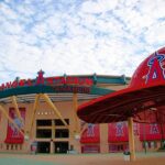 Kroenke’s $4B Power Grab Stuns MLB Angel Stadium entrance with large red baseball cap sculpture
