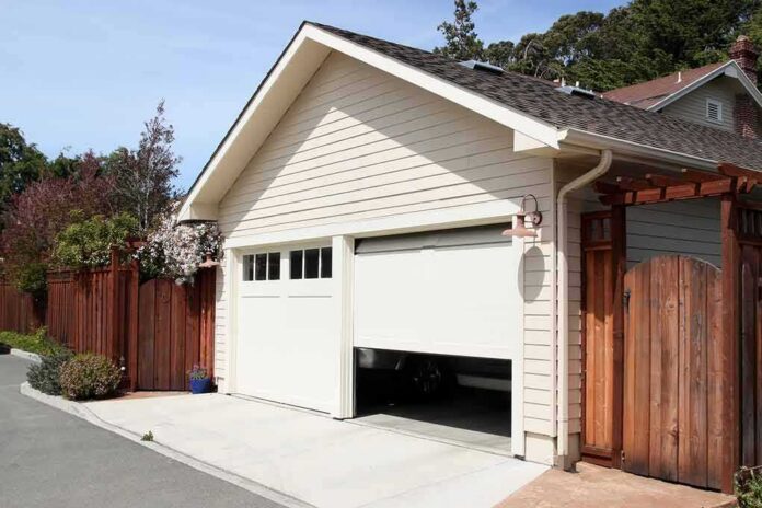 Detached garage with partially open door