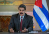 DOJ Indicts Maduro For Torturing Americans Nicolás Maduro speaking at a podium with a microphone