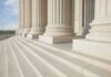 Temporary Means Temporary: Supreme Court Power Play Stuns Immigration Marble columns and steps of a neoclassical building