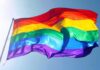 EU Stage Endorses ‘Decontaminate’ Push Rainbow pride flag waving against a clear blue sky