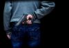 Stadium Night Turns BLOODY : Kids Caught In Crossfire person holding a handgun behind their back