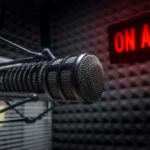 Campus Firestorm After Lillard’s Jaw-Dropping Claim Close-up of a studio microphone with an illuminated on-air sign