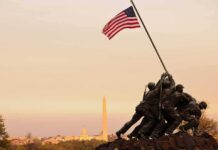 Marine Memorial Beheaded – Chaos at Quantico Iwo Jima Memorial with soldiers raising the American flag at sunset