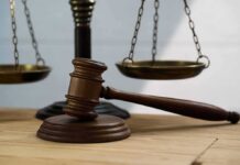 Courtroom Meltdown: ‘White Mediocrity’ – ‘Black Excellence’ Clash Exposed Judge's gavel on block with scales of justice in background