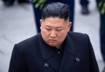 Kim Coma Whispers – Nothing Confirmed Kim Jong-chang in a black overcoat looking to the side