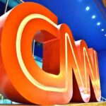CNN Praises MAGA? Trump Hypes The Clip Large red CNN logo sculpture at building entrance