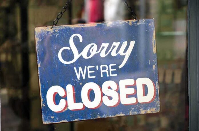 Hanging closed sign on a shop door