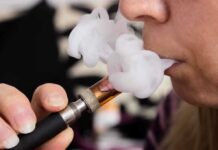 Registry Purge Sparks Smokers’ Comeback Fears Close-up of a person vaping, exhaling smoke clouds