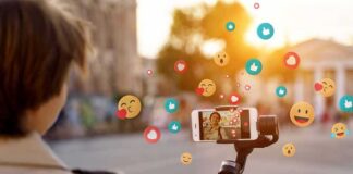 Person livestreaming with smartphone on gimbal outdoors