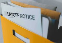 layoff notice in a yellow file holder