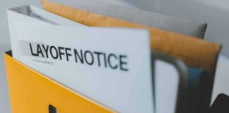 layoff notice in a yellow file holder