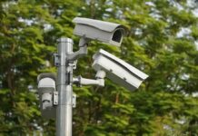 Flock Surveillance – Warrantless Plate Dragnet CRUSHED surveillance cameras mounted on a metal pole