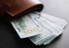 Gallego’s Power Play: Middle Class Fix – or Job Killer? Wallet with US hundred-dollar bills fanned out