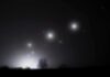 Congress Eyes Mysterious Orb ‘Mothership’ Night sky over a silhouetted landscape with glowing orbs of light
