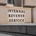 New 1040 Twist: Citizenship Check Before Cash Refunds IRS building stone facade with engraved sign