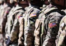 Pentagon Pay Shock – What’s Driving It? Soldiers in camouflage uniforms standing in formation