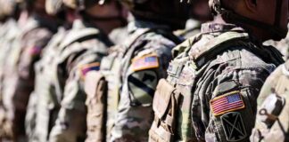 Soldiers in camouflage uniforms standing in formation