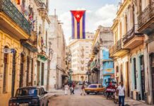 Sanctions Shock: Medicine Still Flows To Cuba Cuban flag over colorful old Havana street