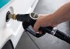 Fuel Shock Wrecks Paxton Momentum A hand holding a diesel fuel nozzle while refueling a vehicle