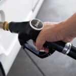 Fuel Shock Wrecks Paxton Momentum A hand holding a diesel fuel nozzle while refueling a vehicle